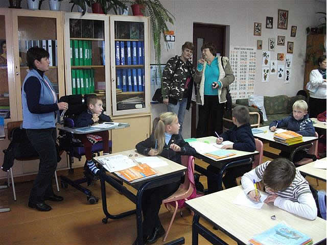 Two sponsors visiting a classroom