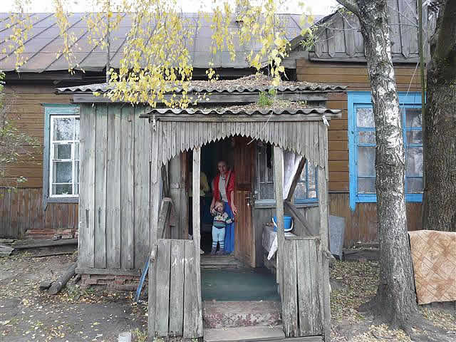 Sponsored children in wooden house